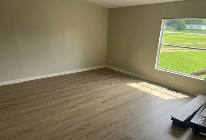 Neutral-toned walls complement wood-finish flooring