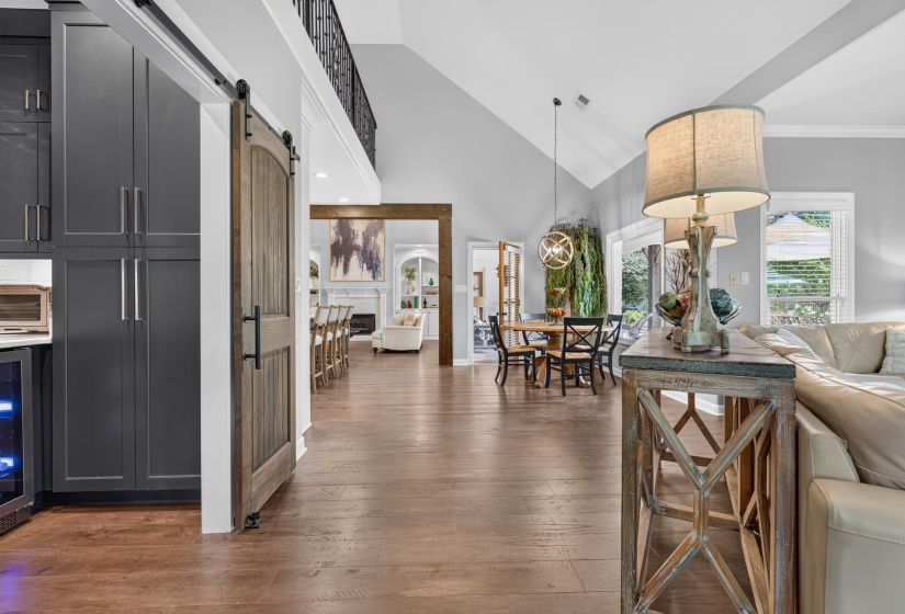 Open-concept living area featuring wood-finish flooring throughout