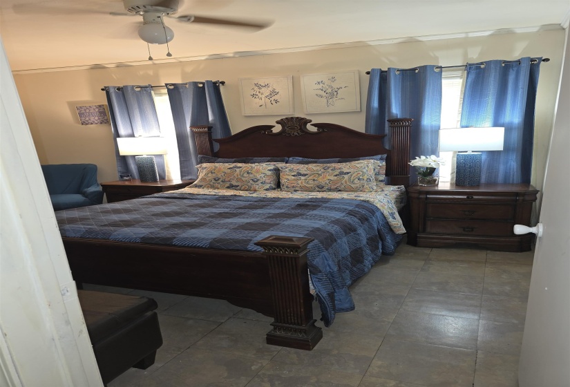 Room featuring tile flooring and a ceiling fan