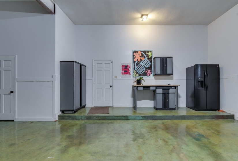 Plenty of storage in this three car garage with additional storage closet and oversized ceilings.