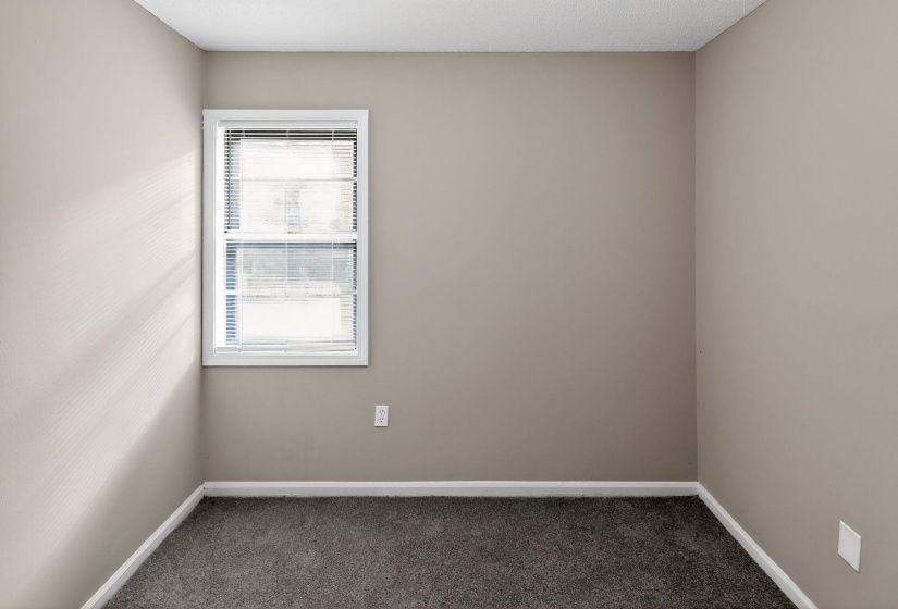 Unfurnished room with carpet flooring and baseboards