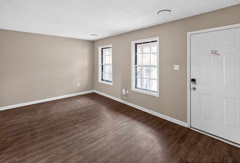 Entrance foyer with dark wood-style flooring