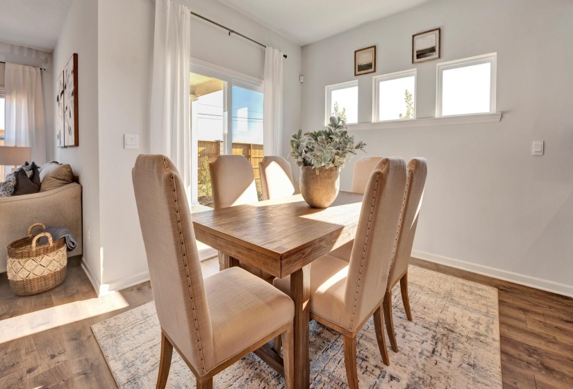 Dining space with baseboards and wood finished floors