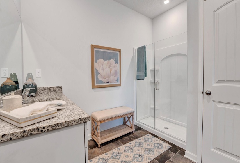 Full bath with vanity and a stall shower