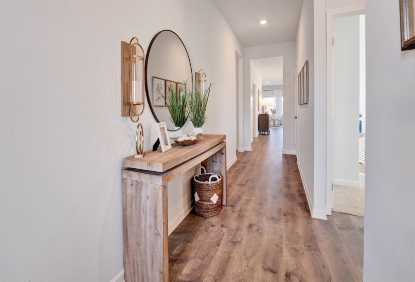 Corridor featuring wood finished floors and recessed lighting