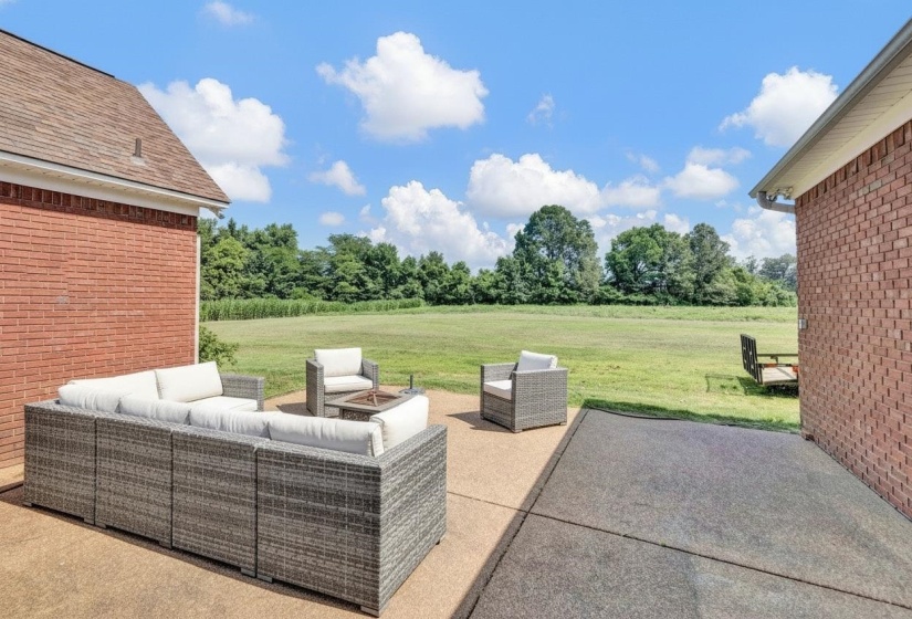Expansive backyard with a concrete patio