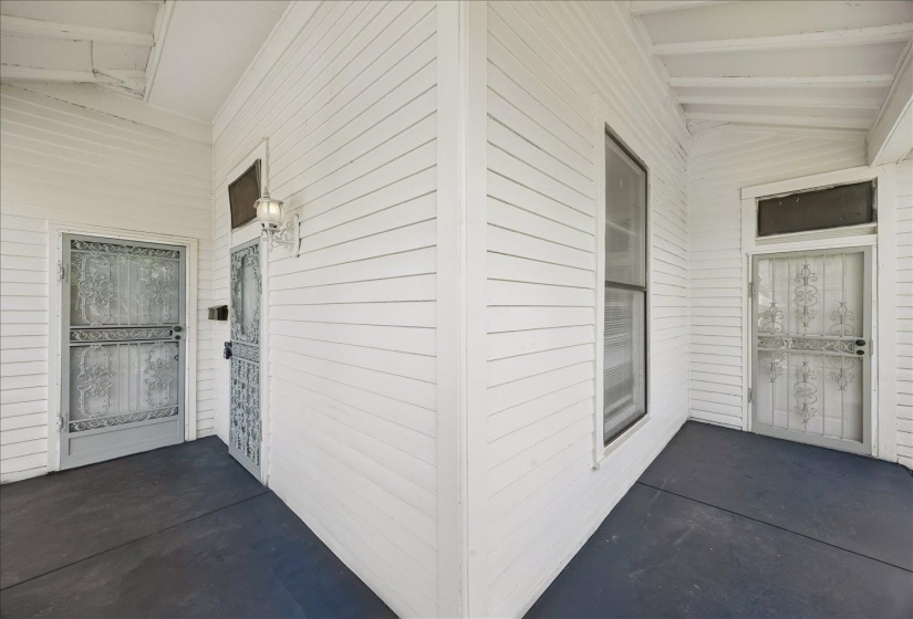 White horizontal siding exterior with dark grey porch flooring