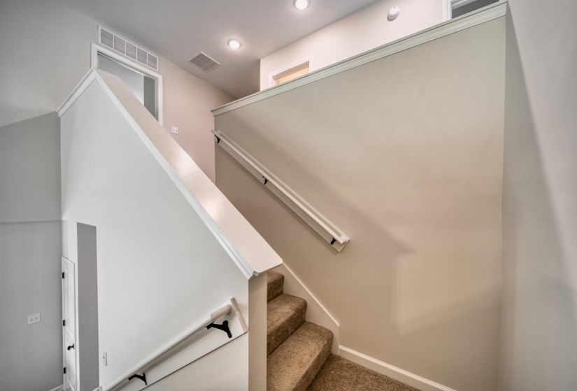 Stairway with baseboards and carpet flooring