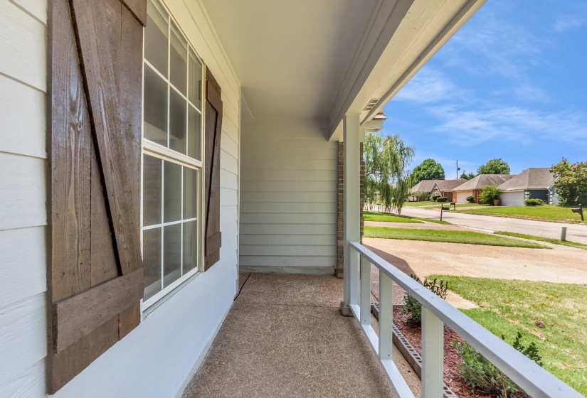 Inviting covered porch with a textured concrete surface