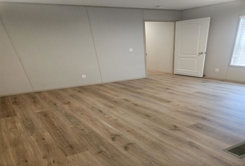Vinyl Wood-finish flooring throughout, complemented by light-toned wall panels