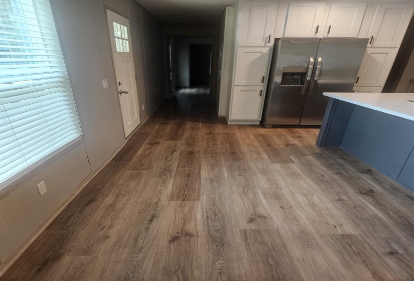 Wood-finish flooring extending throughout the space