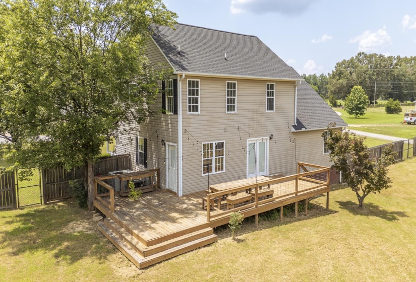 Expansive rear deck with multi-level construction and integrated seating