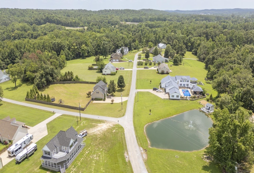 Expansive residential community with green lawns and mature trees