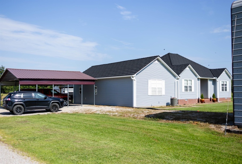 Light blue siding exterior with dark gray roofing
