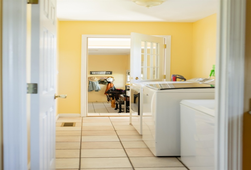 Utility space featuring tile flooring and a light-colored wall palette