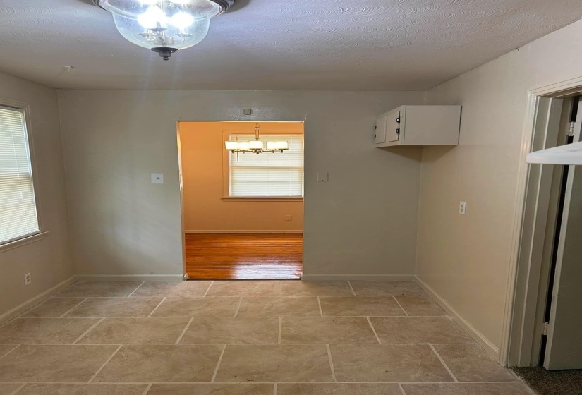 Light-toned tile flooring in a rectangular pattern