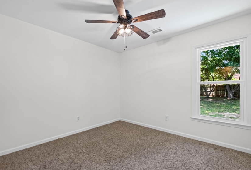 Bright interior space with light-colored walls and soft carpeting
