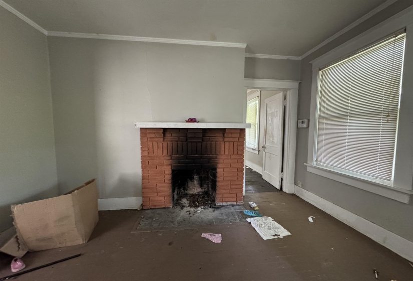 Brick fireplace with a painted mantel