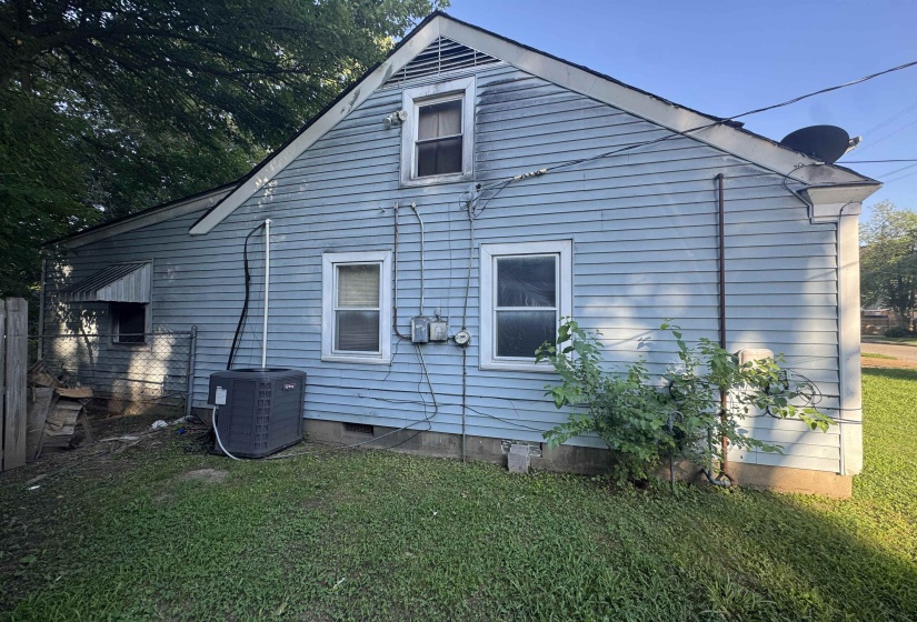 Light blue horizontal siding with white trim and a gable roof