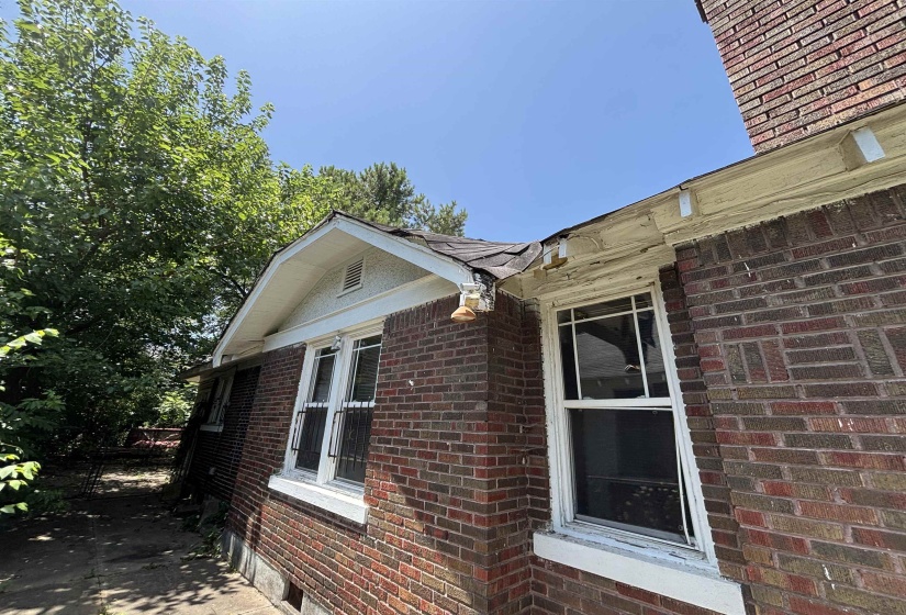 Brick exterior with a prominent gable roofline and white-framed windows