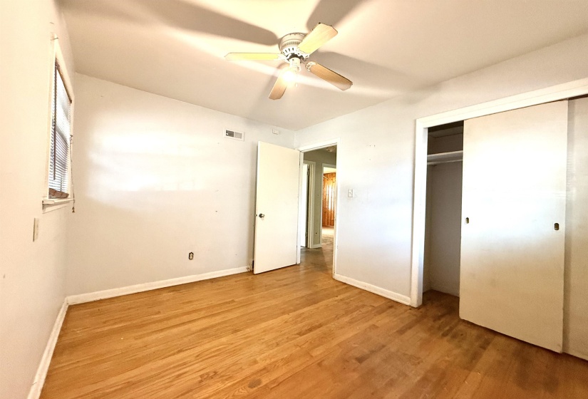 Hardwood flooring complements the light-toned walls