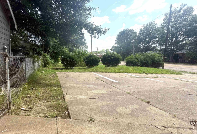Concrete paved area with visible parking space markings