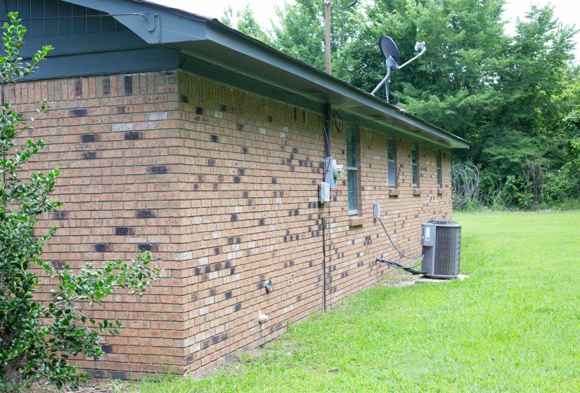 Brick exterior with a dark green soffit and fascia