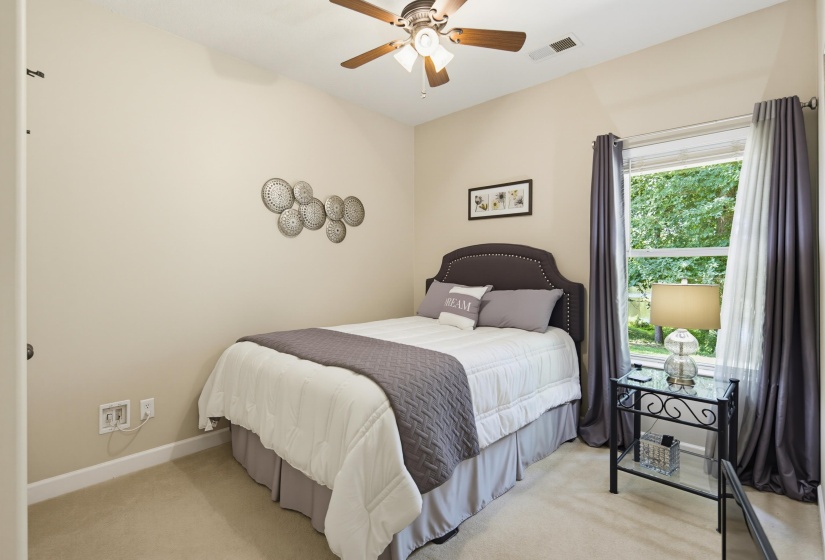 Split floor plan bedroom located off main living area with view of the lake.