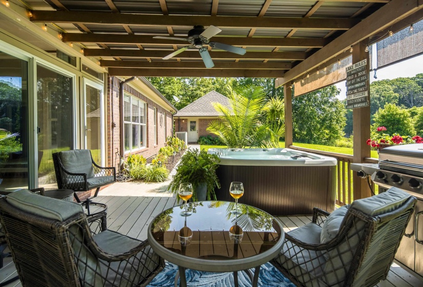 The covered patio sits just off the sunroom for an open feel while entertaining