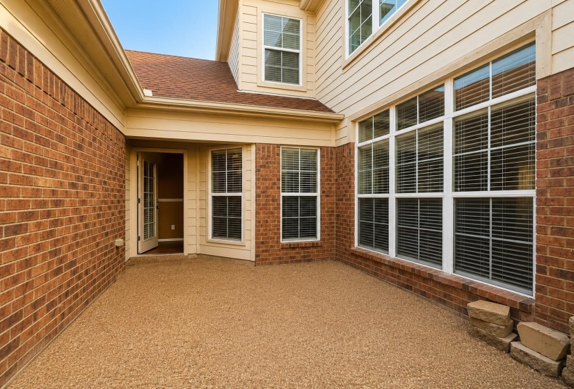 Private courtyard with a textured, low-maintenance surface