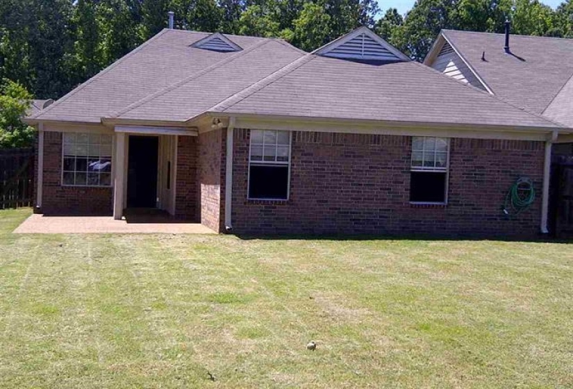 Expansive backyard with a manicured lawn