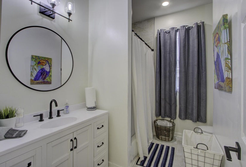 Full bathroom featuring vanity, tile patterned floors, shower / bath combination with curtain, and recessed lighting