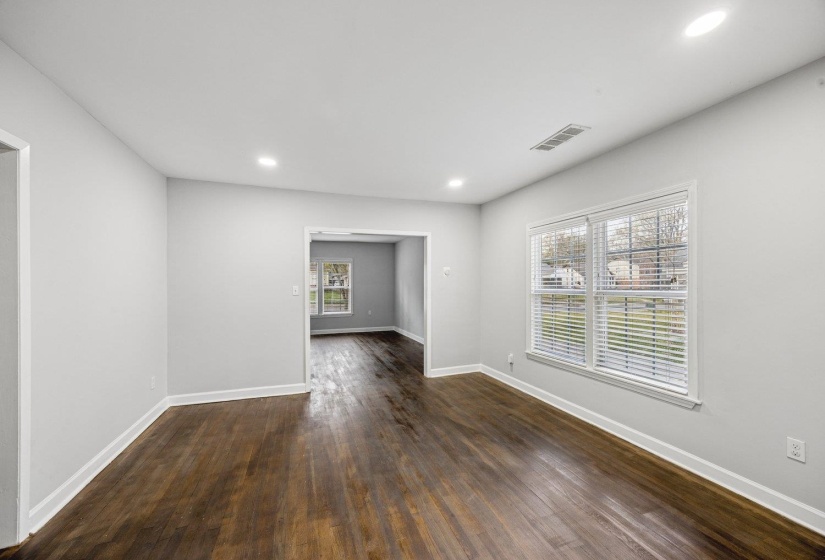Unfurnished room with dark wood finished floors and recessed lighting