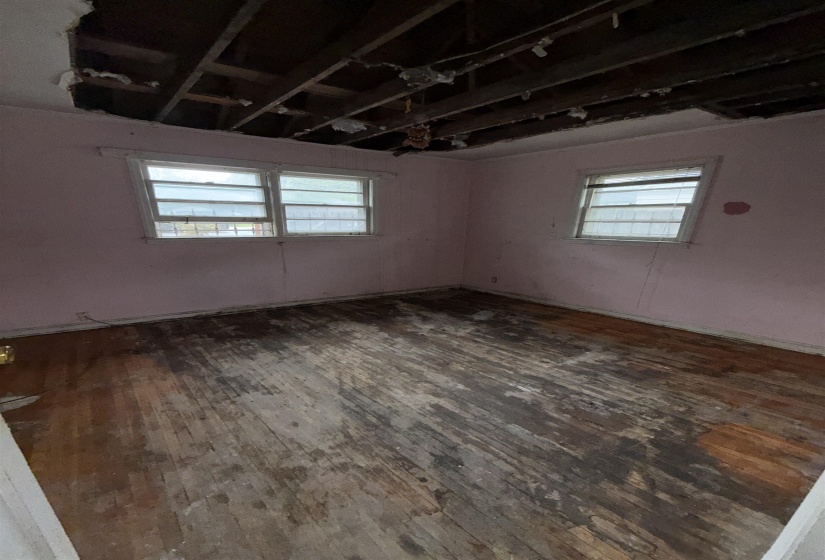 Unfurnished room featuring dark wood finished floors