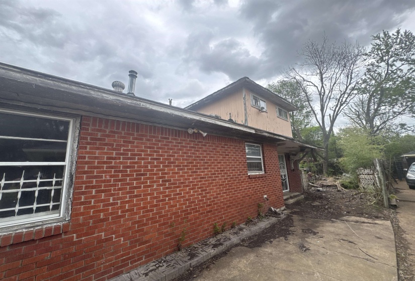 View of home's exterior featuring brick siding