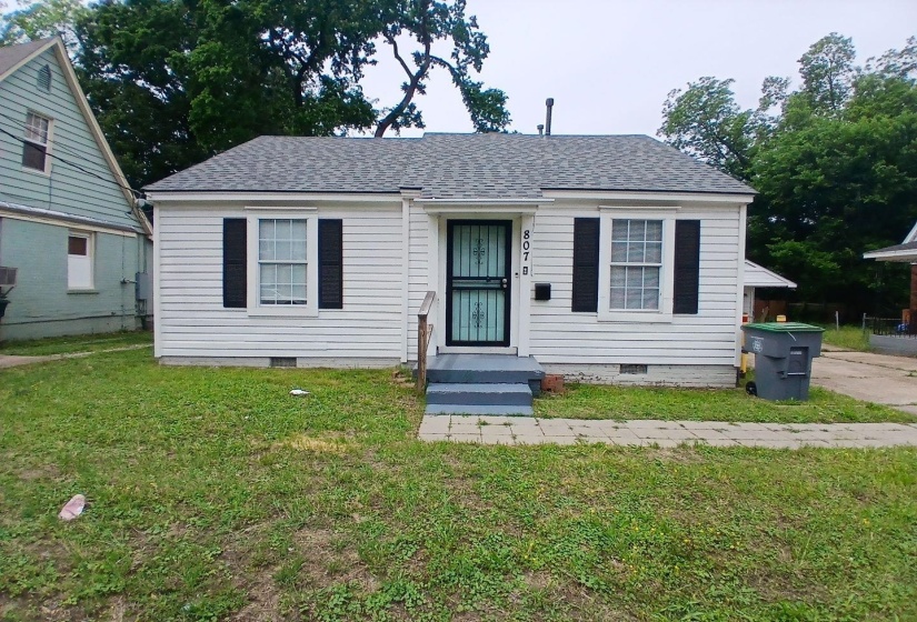 White siding exterior with a dark shingle roof