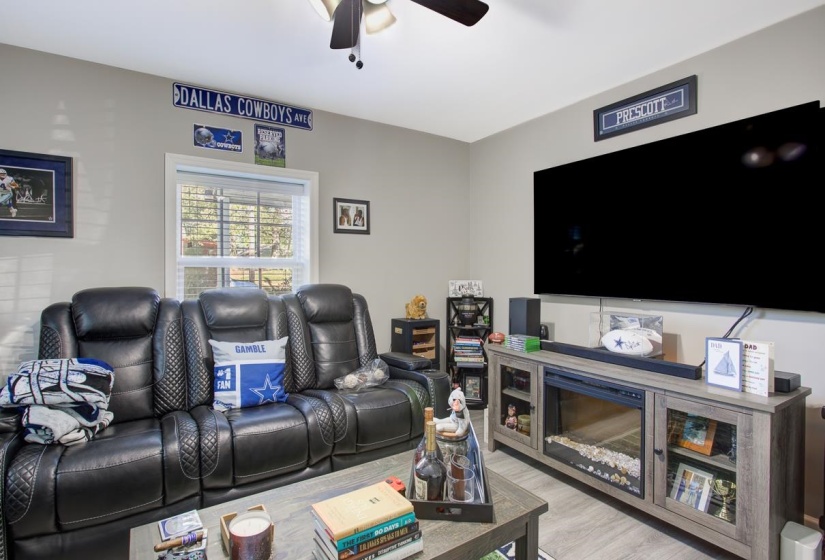 Living area featuring ceiling fan and light LVP flooring