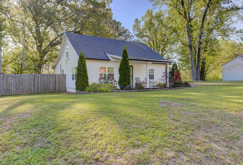 View of front of house featuring roof with shingles and a porch