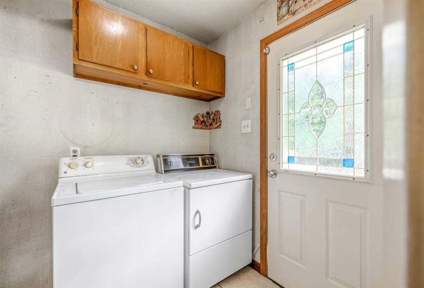 Entry door featuring decorative stained glass