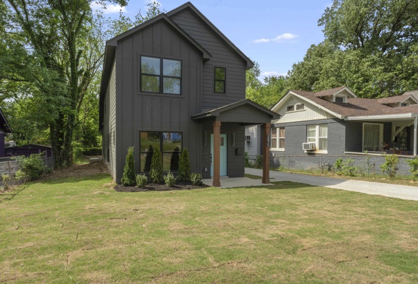 View of front facade with board and batten siding