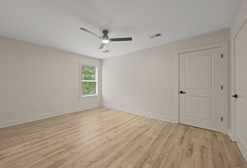 Unfurnished room with light wood-style flooring and ceiling fan
