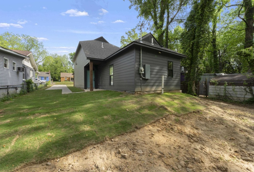 Back of house featuring a lawn