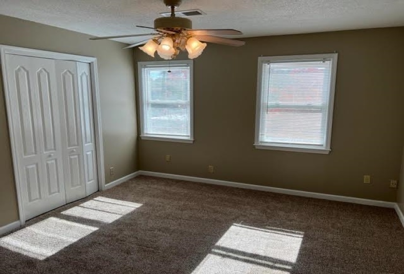Wall-to-wall carpeting and neutral wall tones