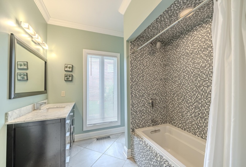 Tiled bath and shower combination with a large soaking tub