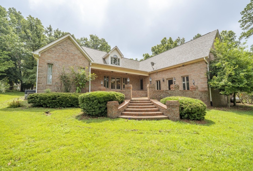 Brick exterior with gabled roof lines and an attic dormer