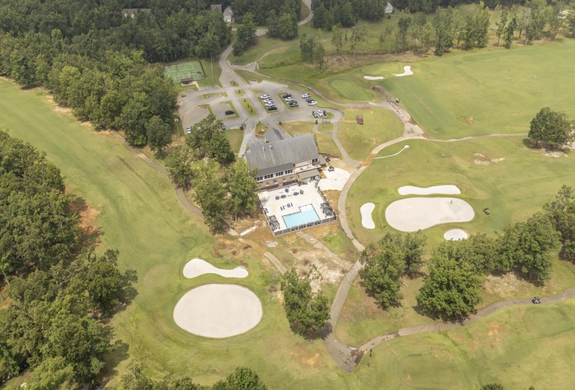 Aerial view showcasing a golf course with multiple greens and sand traps