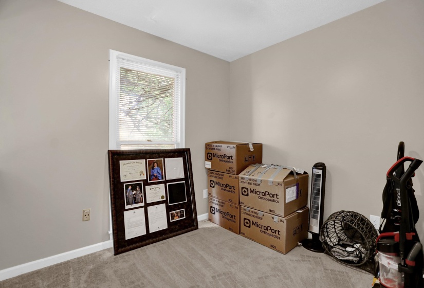 Room featuring neutral wall paint, white trim, and light-colored carpet flooring
