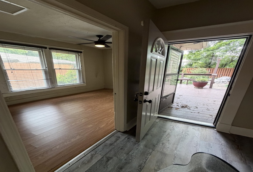 Entryway with wood-finish flooring transitioning to a deck