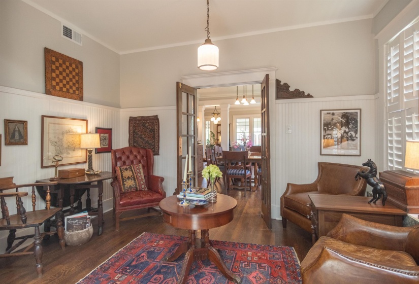 Interior room featuring wood-finish flooring and white beadboard wainscoting