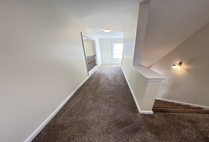 Hall featuring carpet floors